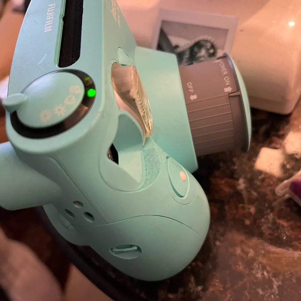 Polaroid camera made by Fujifilm called the Instax mini 7s